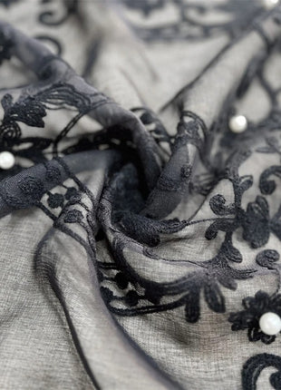 a close up of a black and white fabric