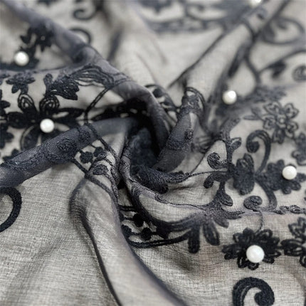 a close up of a black and white fabric