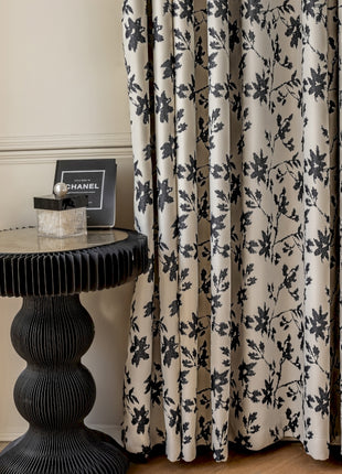 a black and white table sitting next to a window
