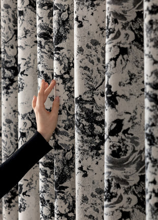 a woman is touching a wall with her hand