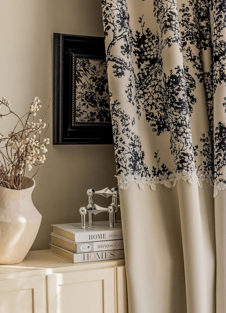 a vase of flowers sitting on top of a dresser