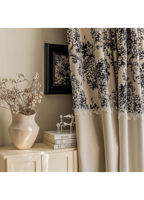 a vase of flowers sitting on top of a dresser