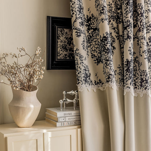 a vase of flowers sitting on top of a dresser