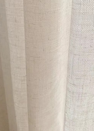 a close up of a curtain with a white background