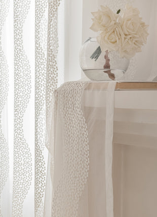 a vase with flowers sitting on a window sill