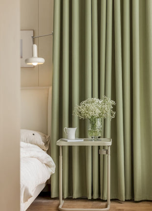 a table with a vase of flowers on top of it