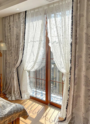 a bedroom with a large window and a bed